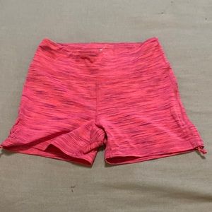 Pink athletic shorts.